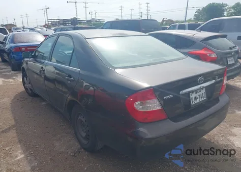 2002 Toyota Camry Le z USA, uszkodzony, nr VIN JTDBE32K720119418